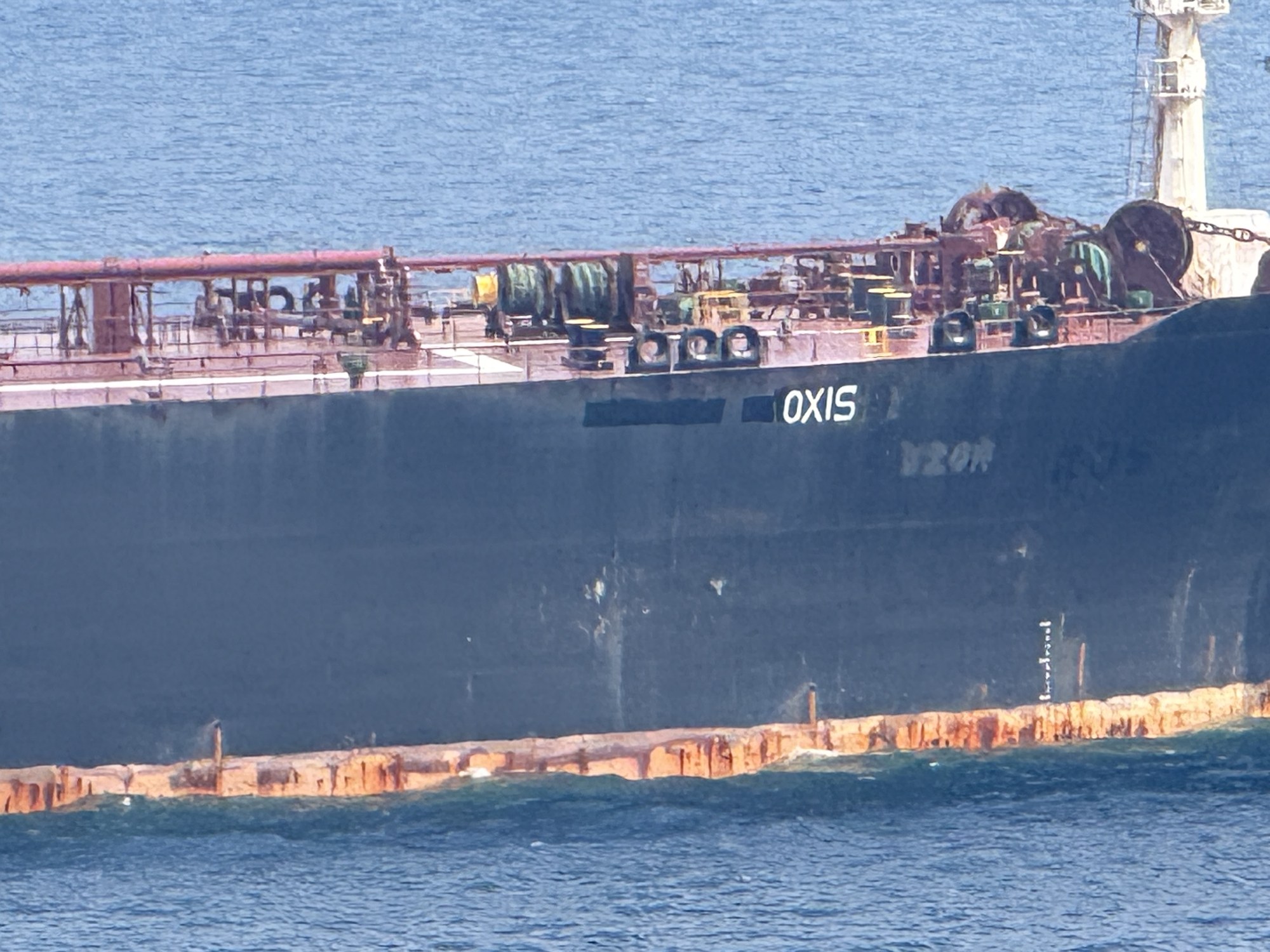 OXIS, IMO 9224805. Former Uzor and Kos painted out. Singapore approaches. AIS off. No flag.